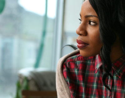 Image of woman looking out of a window